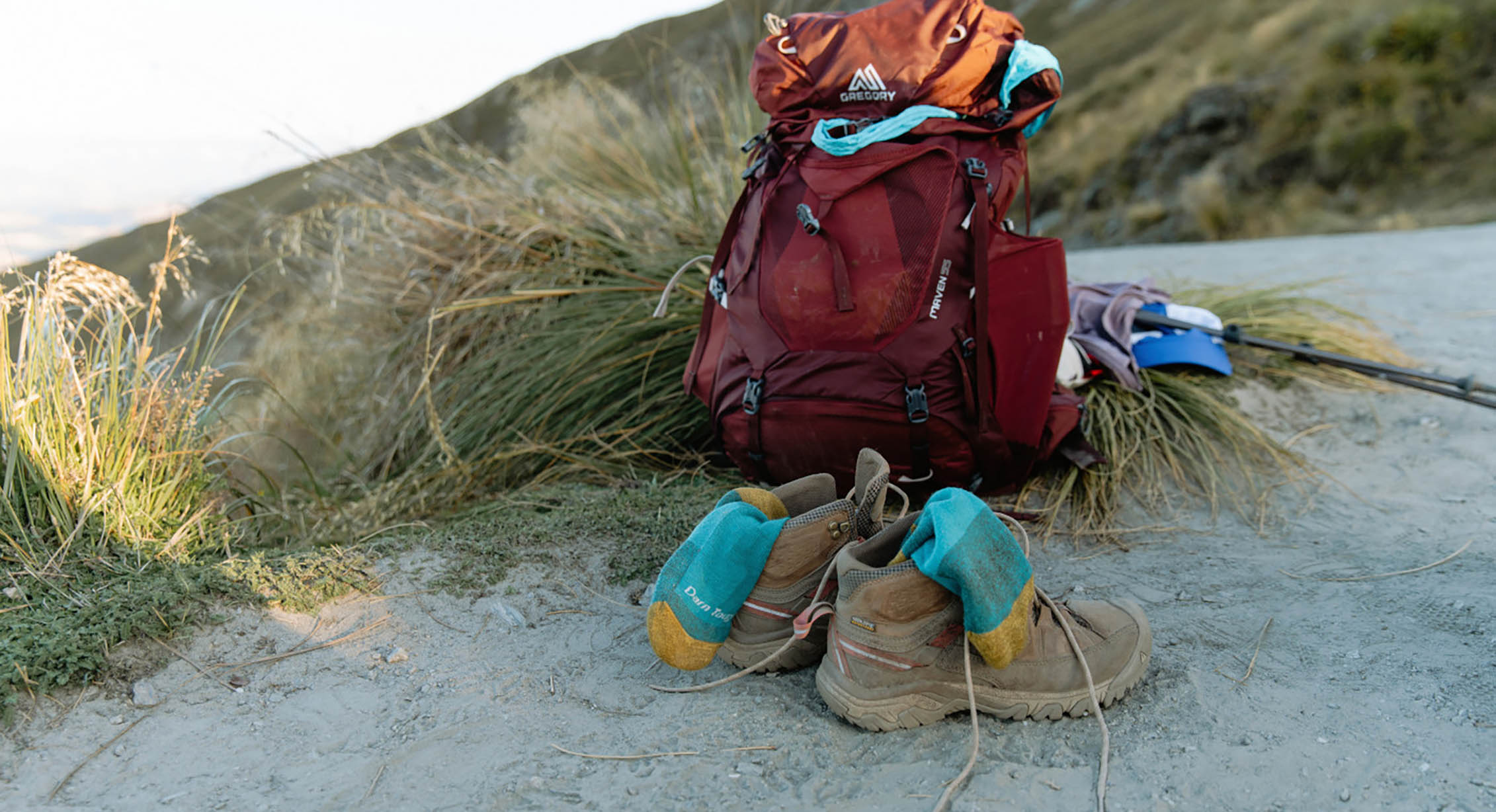 a packed backpack and hiking shoes