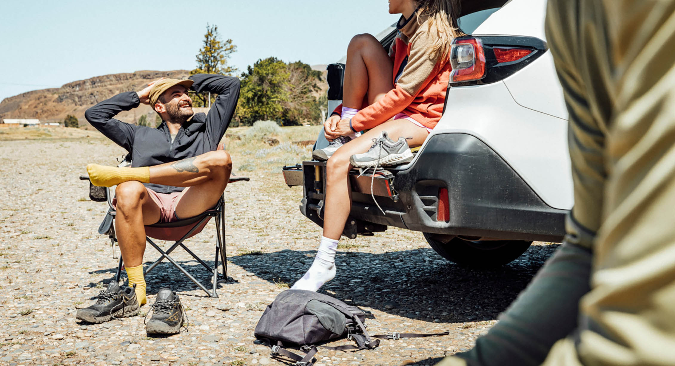 hikers relax in chairs at the trailhead