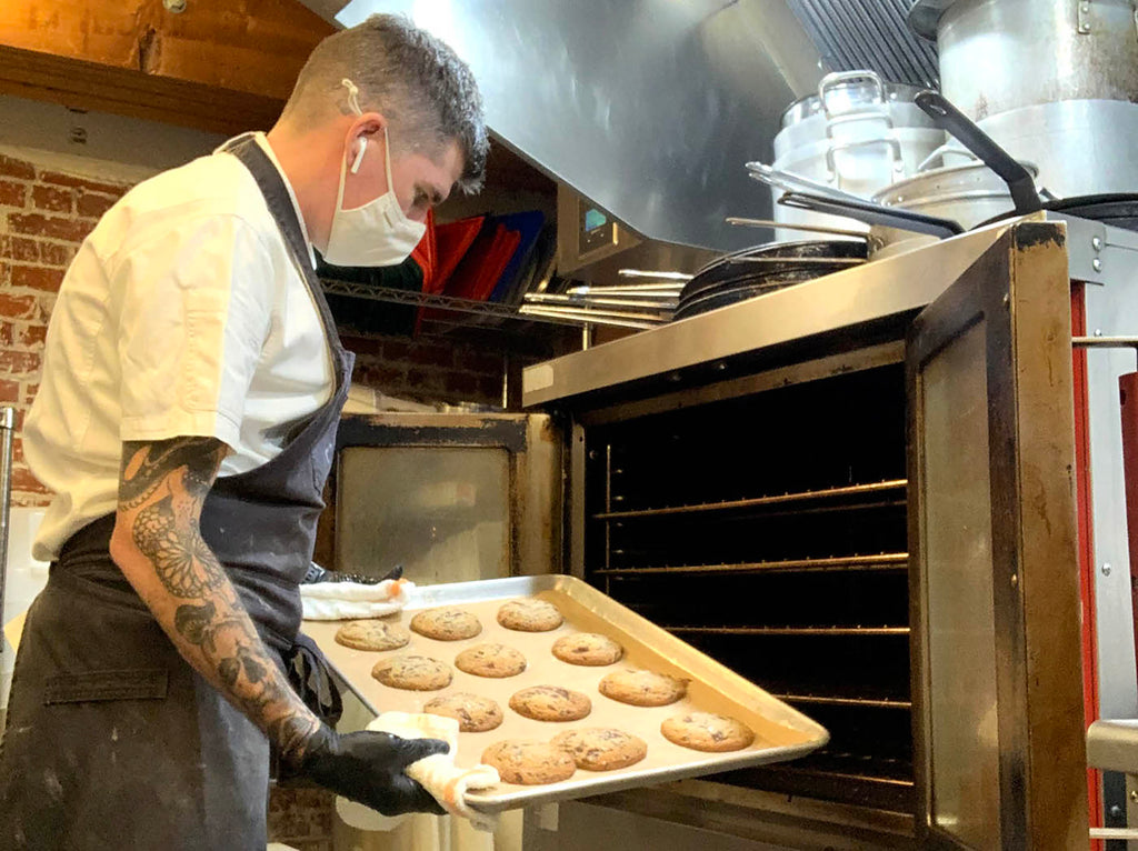 taking cookies out of the oven