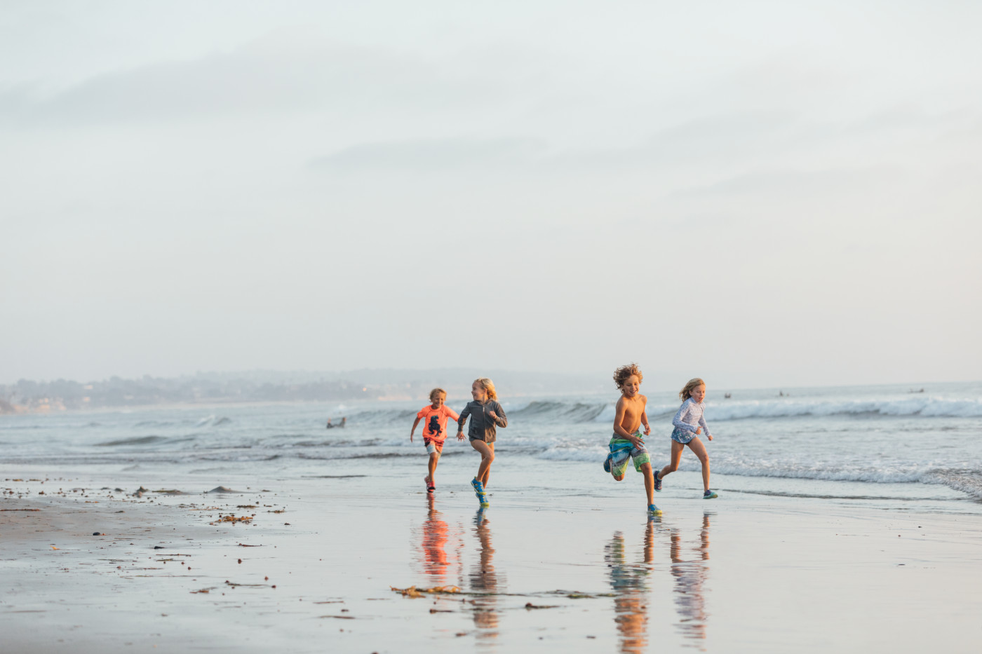 Kids at the beach in KEEN water shoes