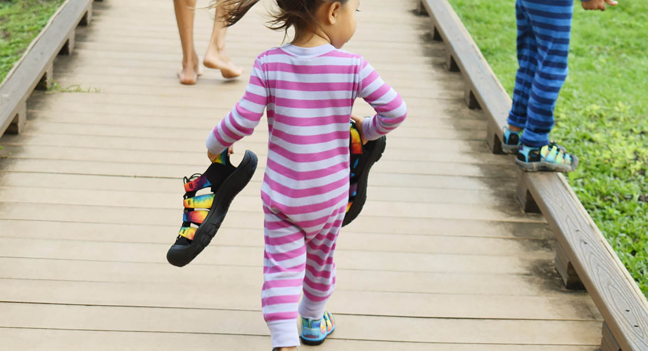 A toddler on a family walk